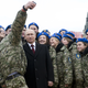 Putin poses for a selfie with members of a youth military patriotic club.